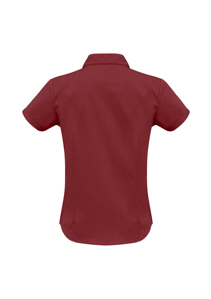 A women's short sleeve button-up shirt in a deep maroon colour with a fitted design and collar.