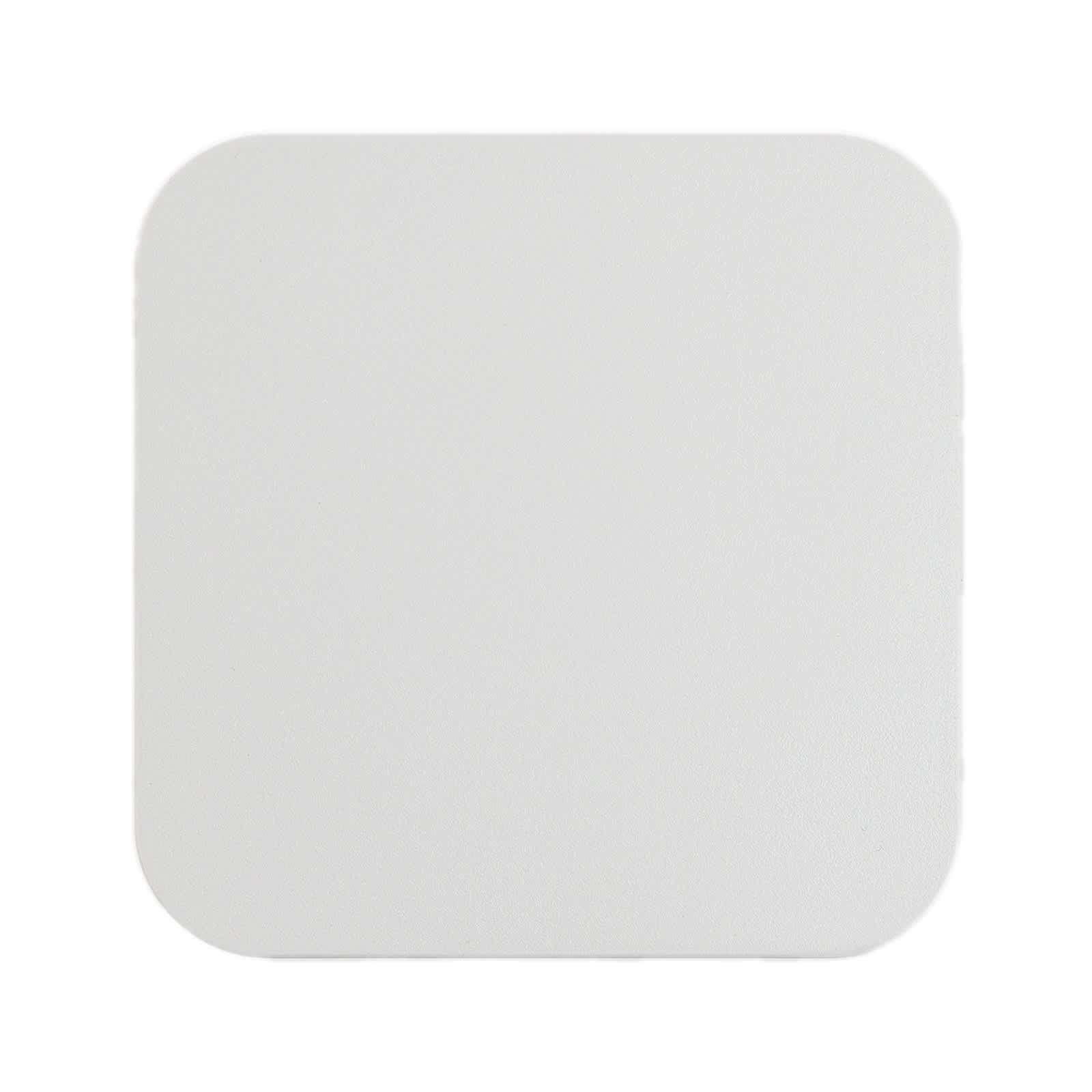 A square wireless charger in a smooth white finish.