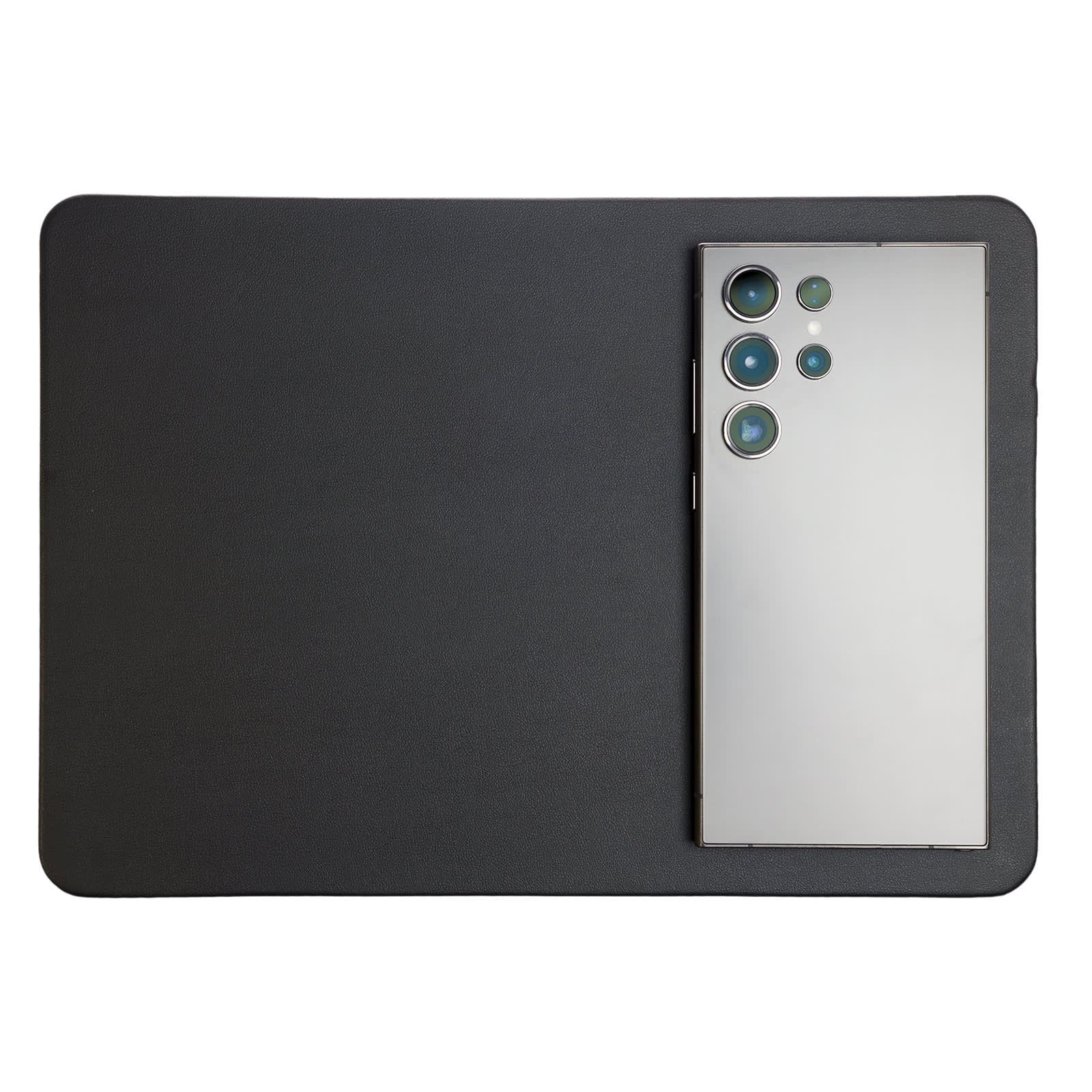 A wireless charger and mouse pad combination featuring a sleek black design, with a smartphone positioned on top.
