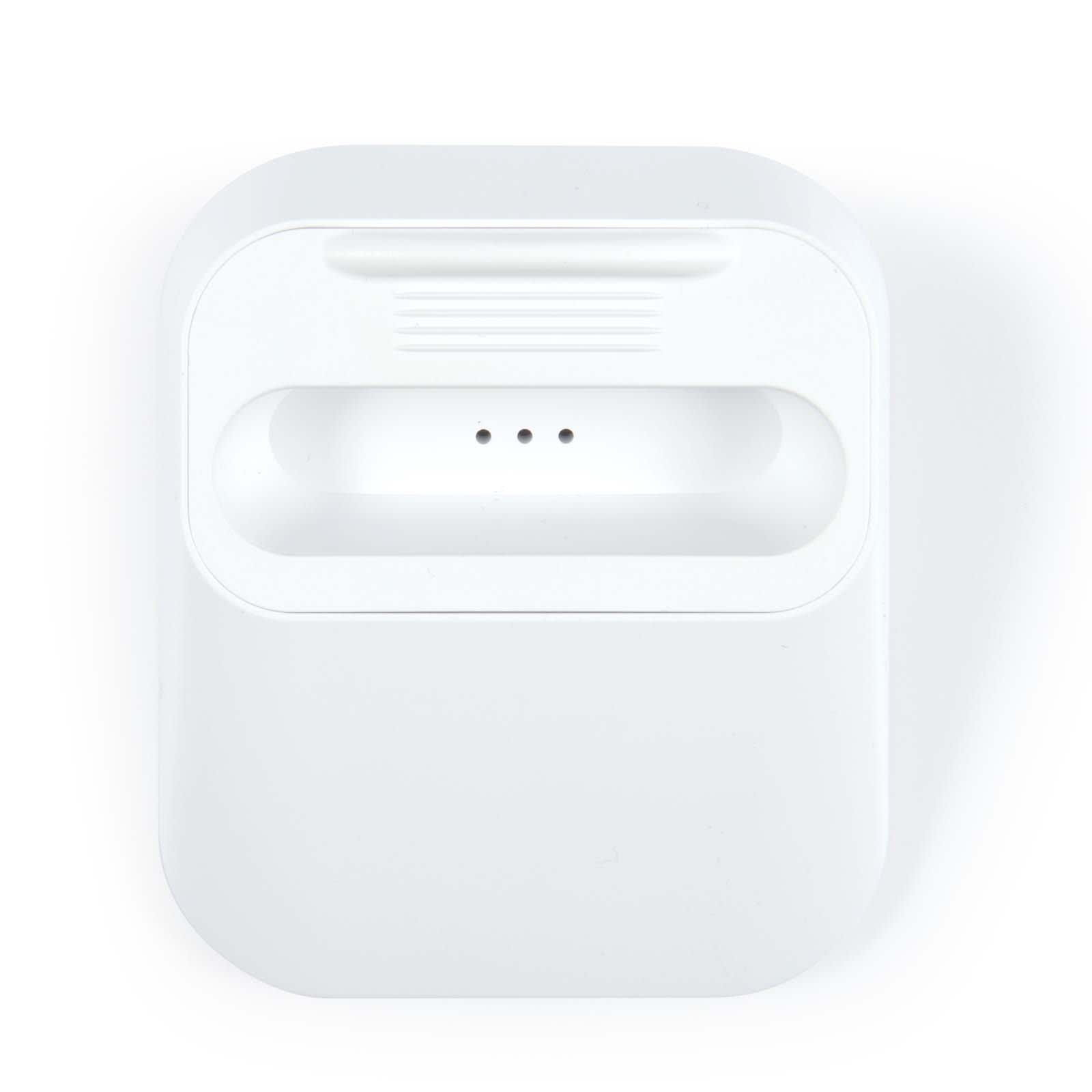 A white wireless power bank with a flat design and three indicator lights on the top.
