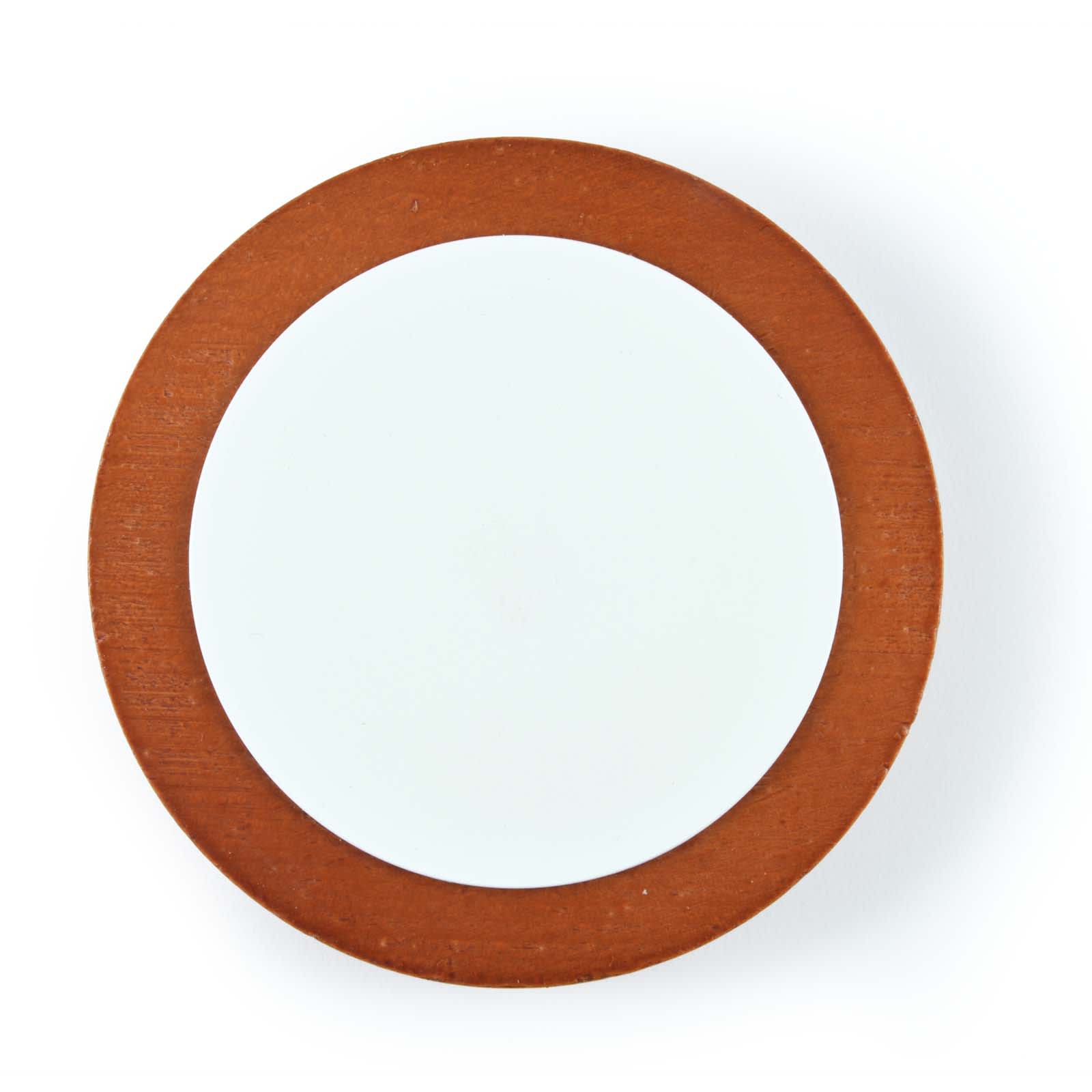 A round wireless charger with a wooden brown exterior and a smooth white interior. It features a logo on the surface.