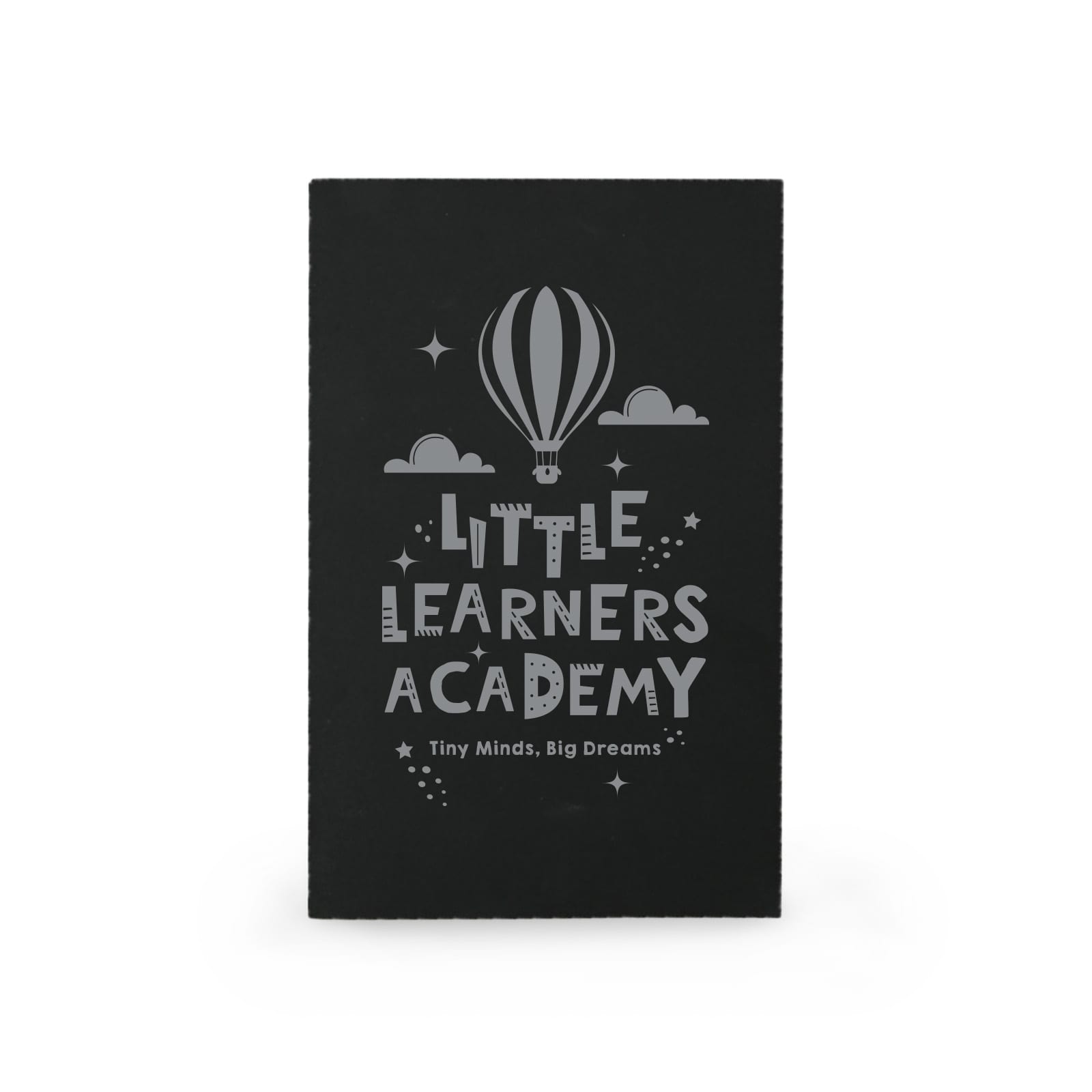 A black notebook featuring a hot air balloon design and the text 