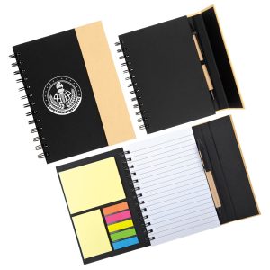 A spiral-bound notebook with a black cover, containing lined pages, sticky notes, and a logo.