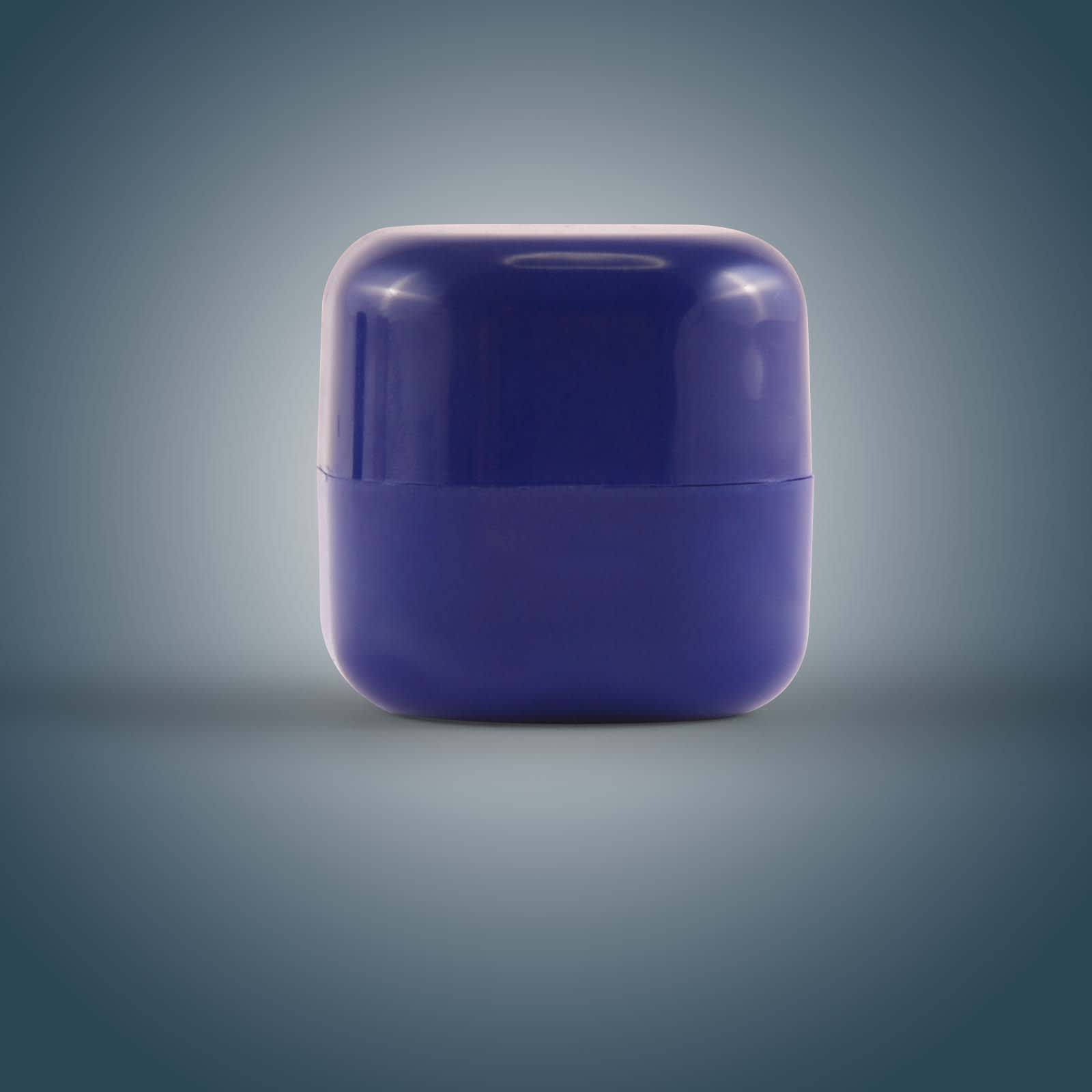 A purple cube-shaped lip balm container with a glossy finish, featuring a smooth, rounded design.