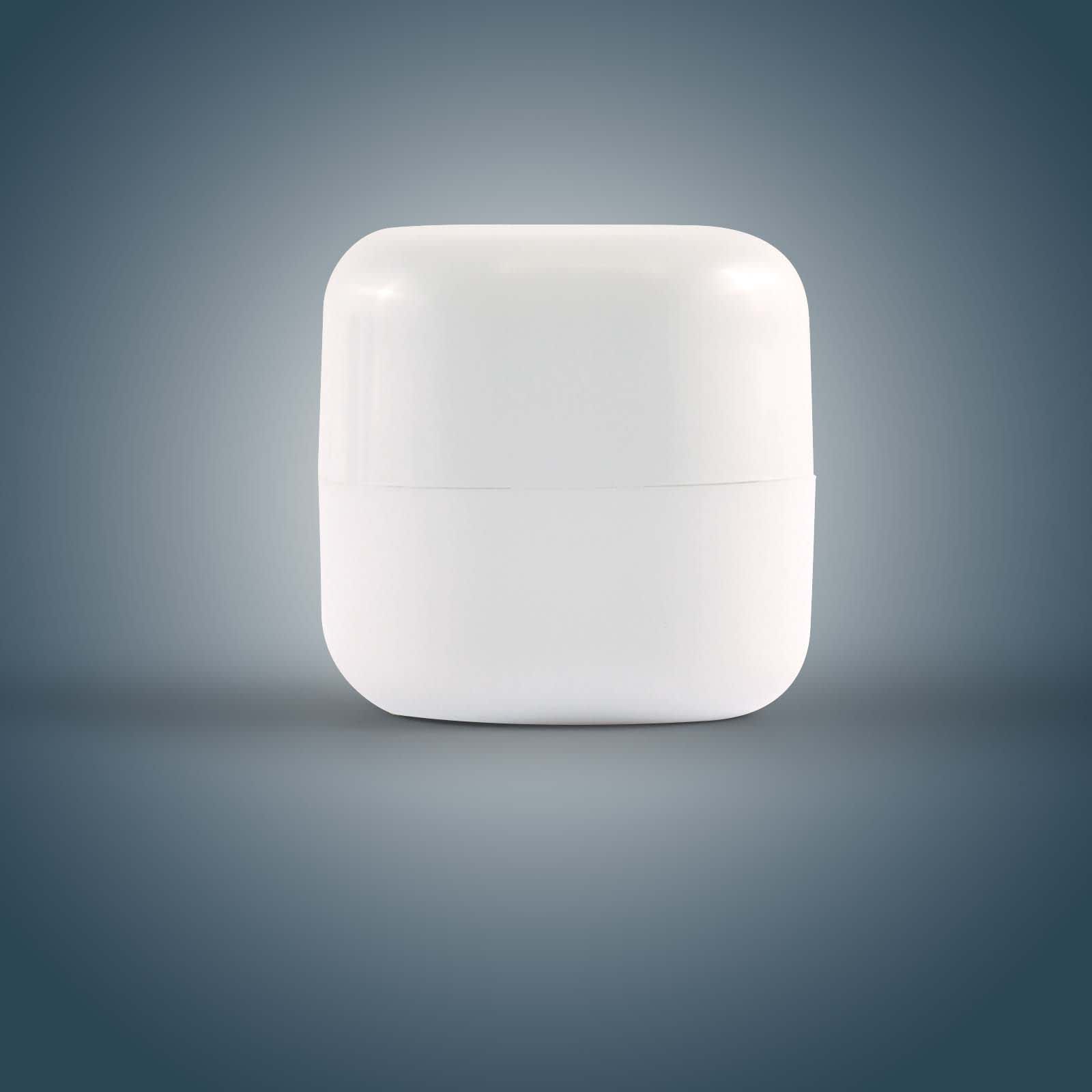 A cube-shaped white container of lip balm, featuring a smooth surface and rounded edges.