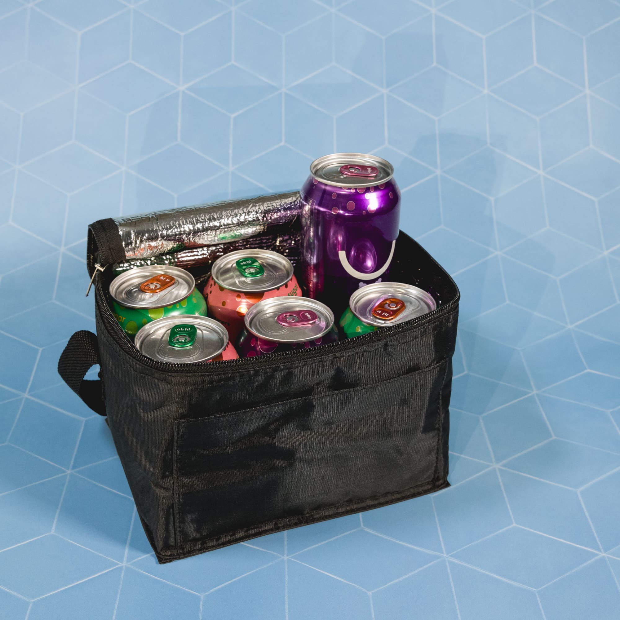 A teal cooler bag with a black strap, featuring a logo and various food graphics.