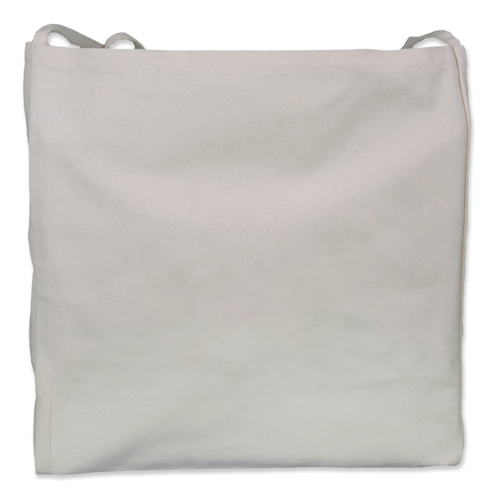 A cream-coloured tote bag is held by a person wearing a black top and blue jeans. The bag has a simple design and a logo.