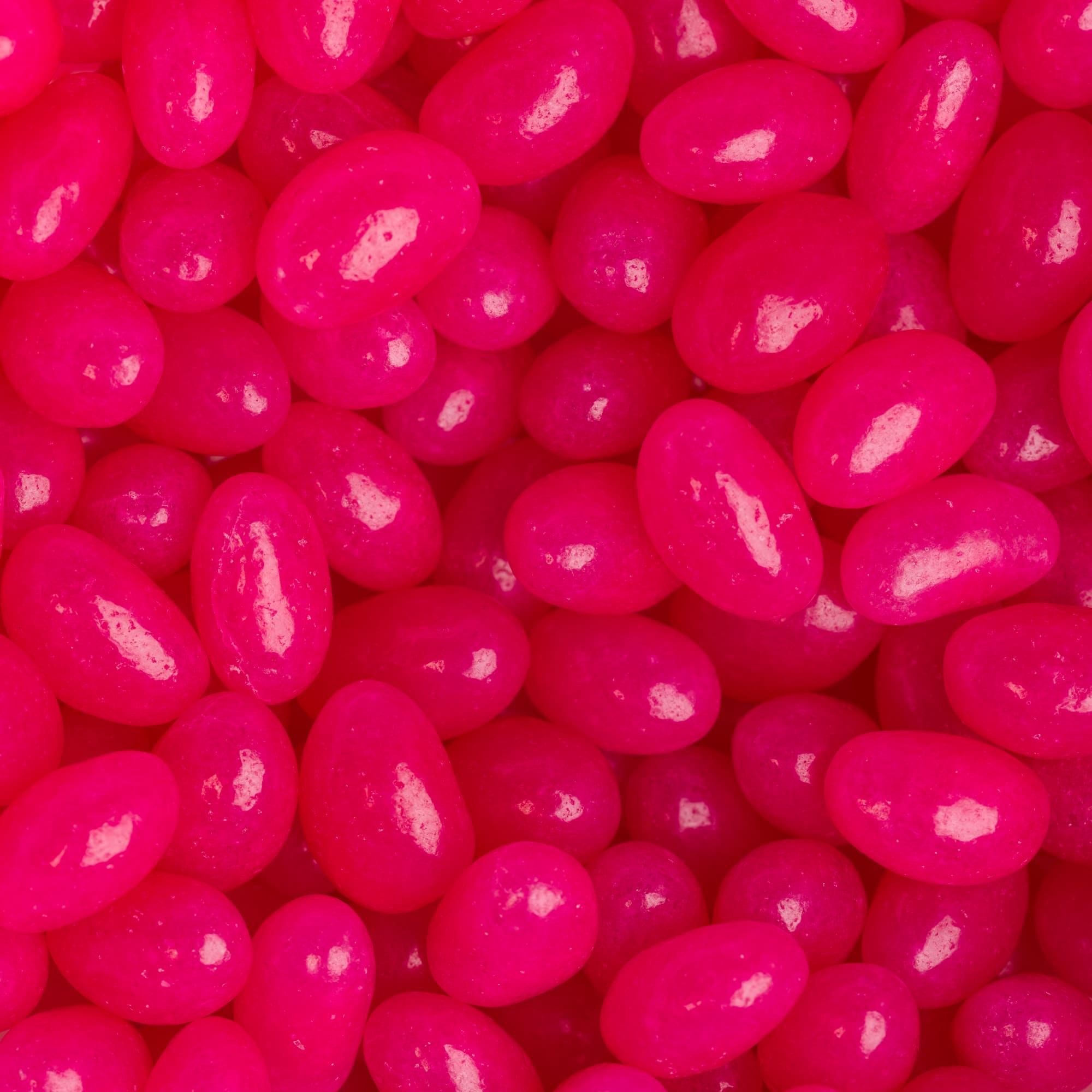 Mini jelly beans in a vibrant pink color, part of the Corporate Colour range.