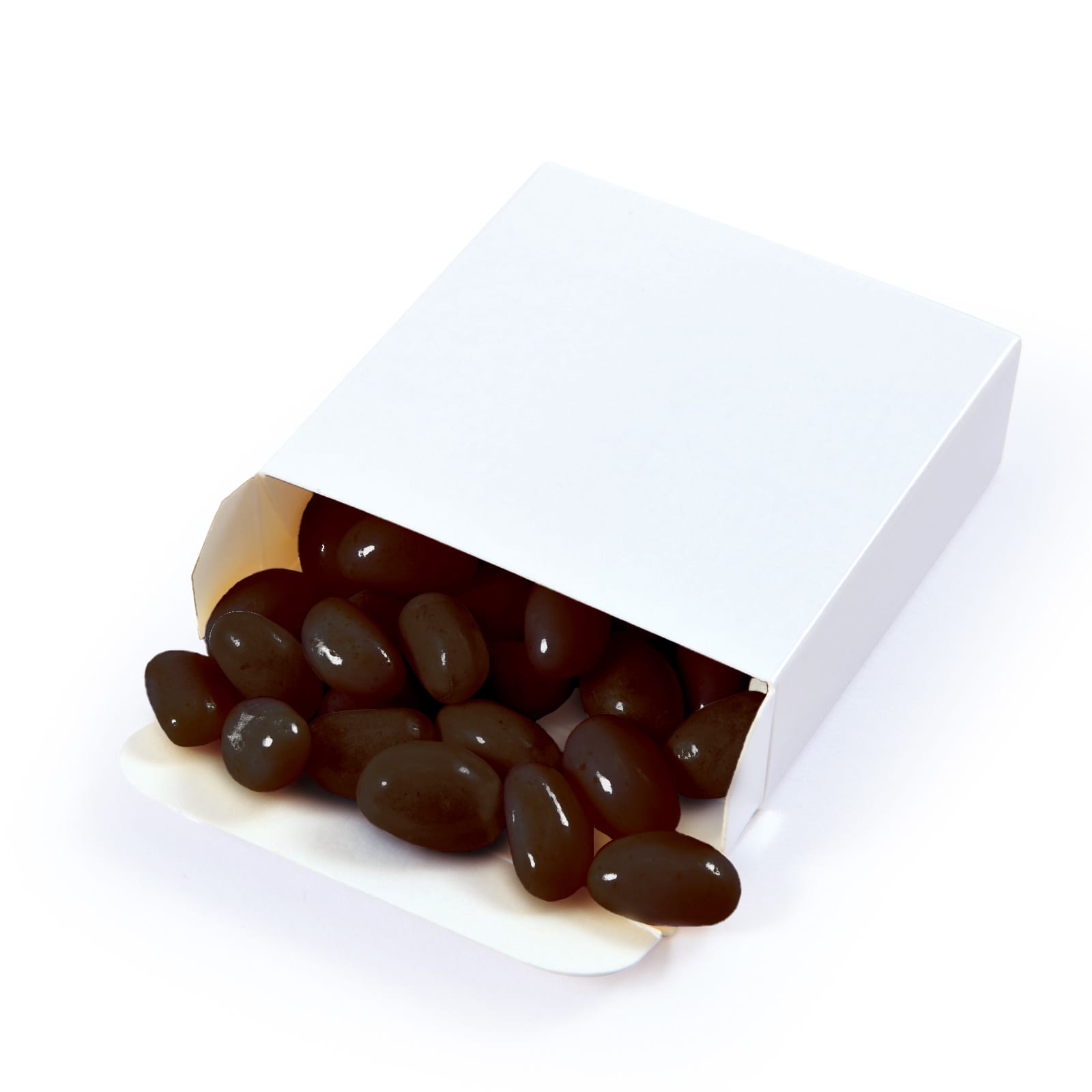 A box of black jelly beans is partially opened, with several beans spilling out onto a white background.