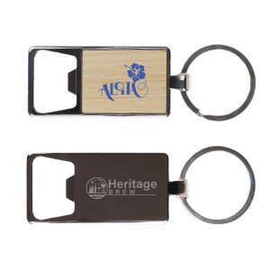 A drink bottle opener keytag featuring a wooden panel with a floral design and a metallic finish. It has a keyring attachment.