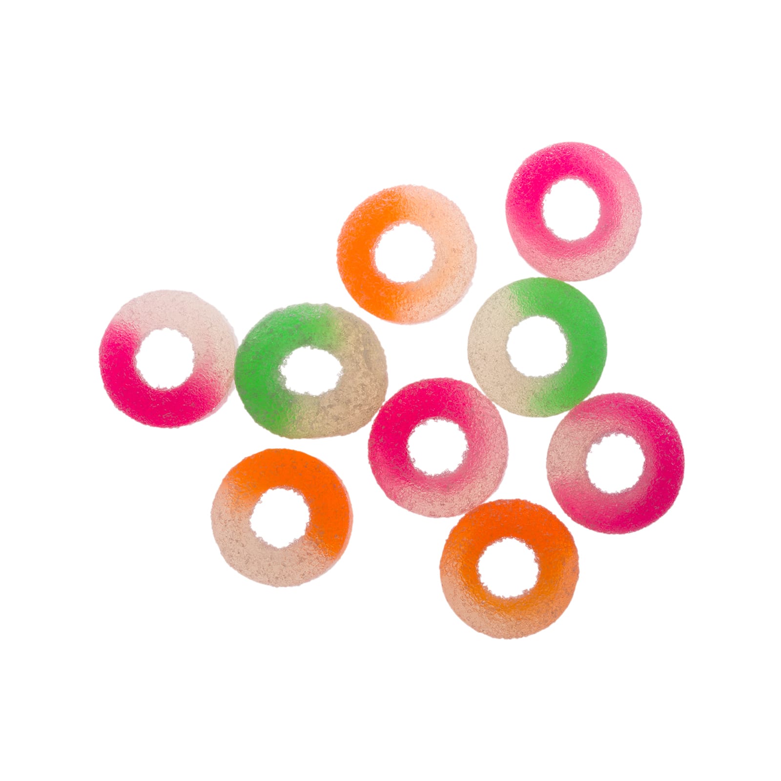 Assorted fruit-flavored gummy rings in various colors, scattered around a partially opened roll.