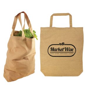 A short-handled, mustard yellow tote bag being held by a hand. The bag features an unembellished design and has a logo.
