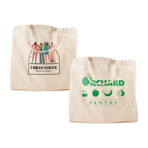A beige reusable calico bag with short handles held by a person, featuring a simple design and no visible branding.