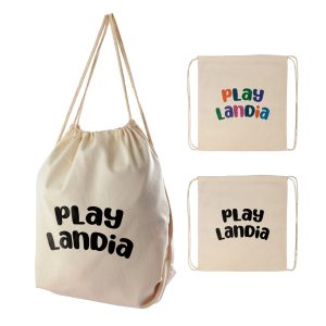 A cream-coloured drawstring backpack is worn on the back of a person, featuring simple cord straps and a gathered top.