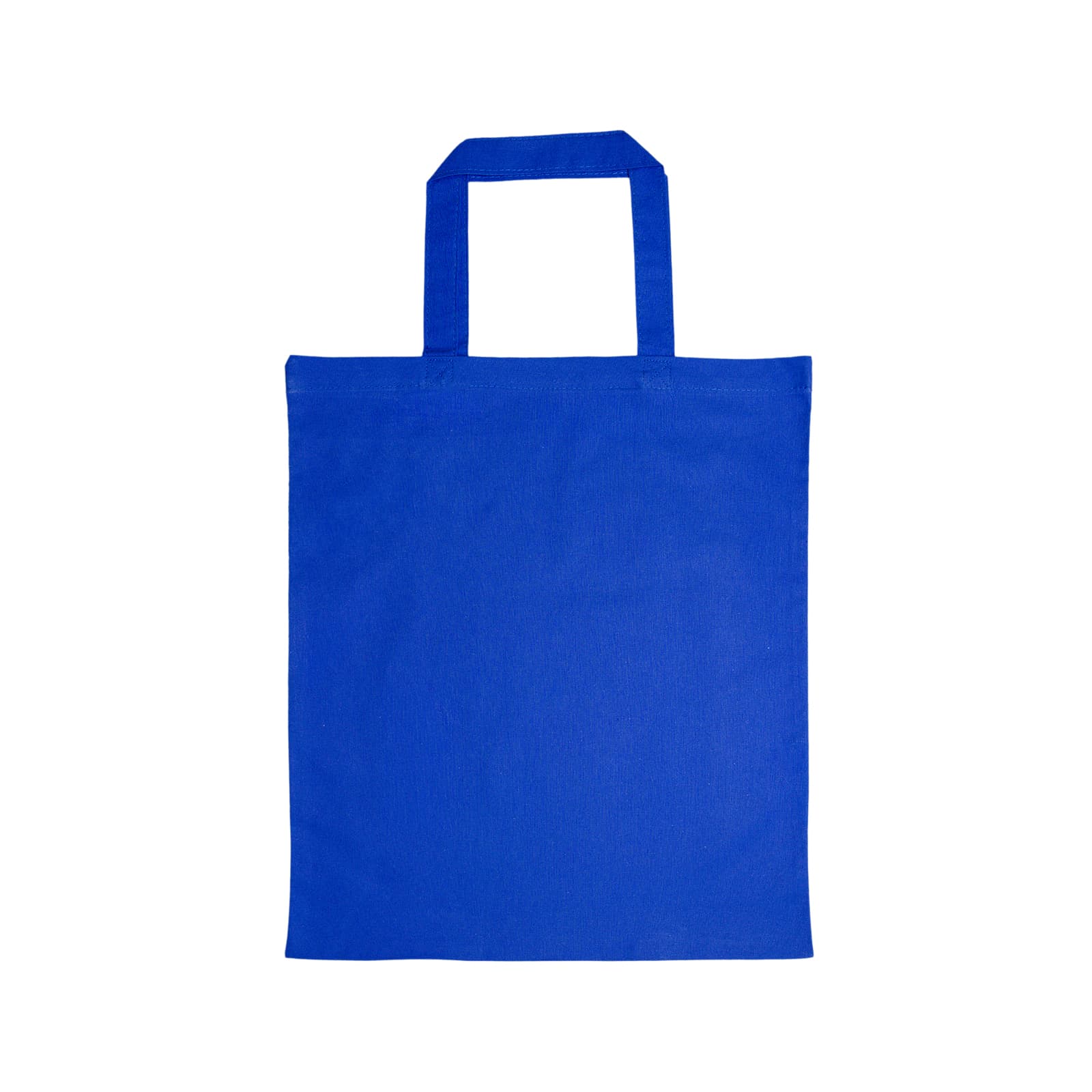 A woman carries a plain white cotton tote bag with short handles, wearing casual jeans and a black top.