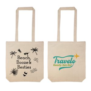 A woman holds a natural-coloured tote bag with long handles. The bag features a logo.