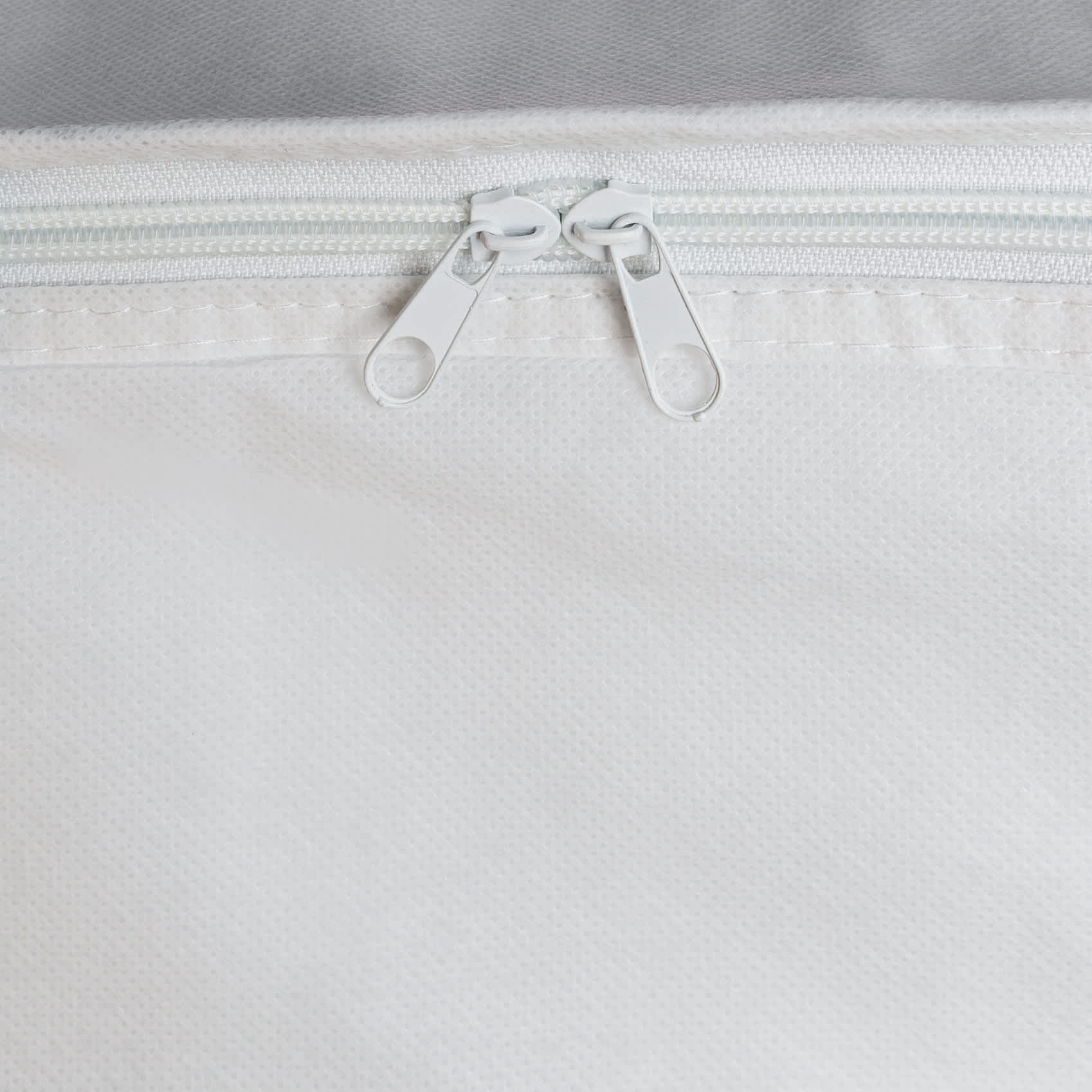 A white cooler bag featuring double zipper closures. The material appears durable and water-resistant.