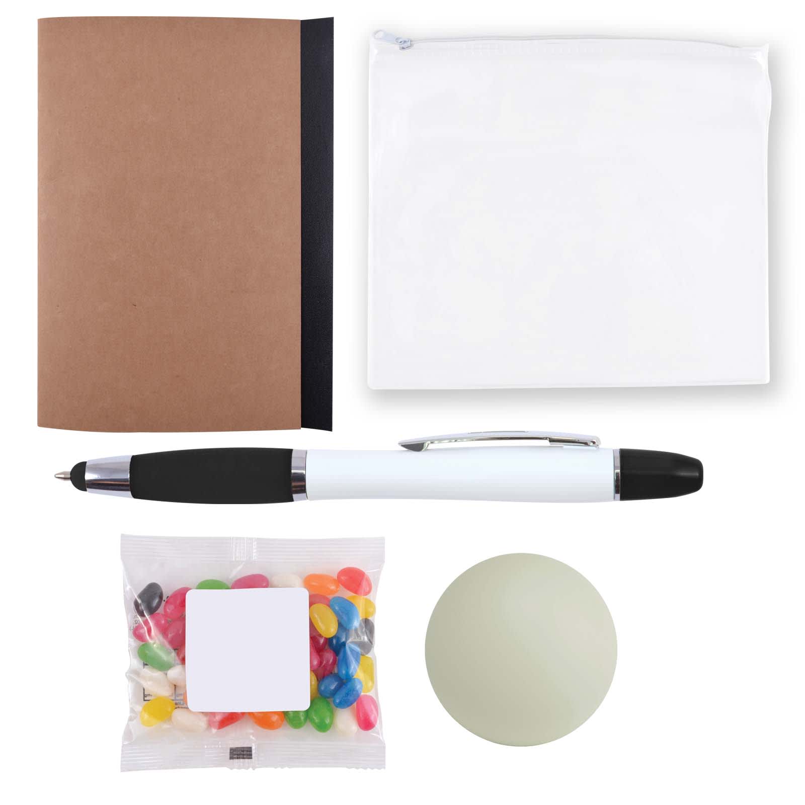 A brown notebook, a clear pouch, a black and white pen, a bag of colorful jelly beans, and a green stress ball.
