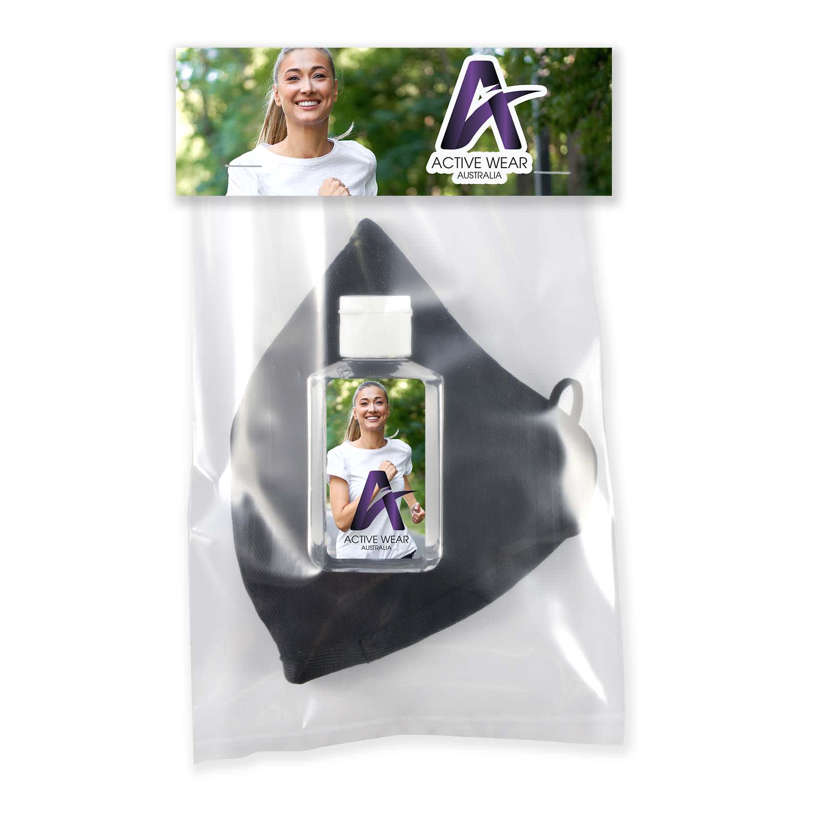 A black face mask and a clear hand sanitiser bottle in a sealed package, featuring branding.