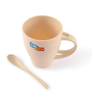 A reusable coffee cup in beige wheat fiber with a matching spoon, featuring a logo on the cup.