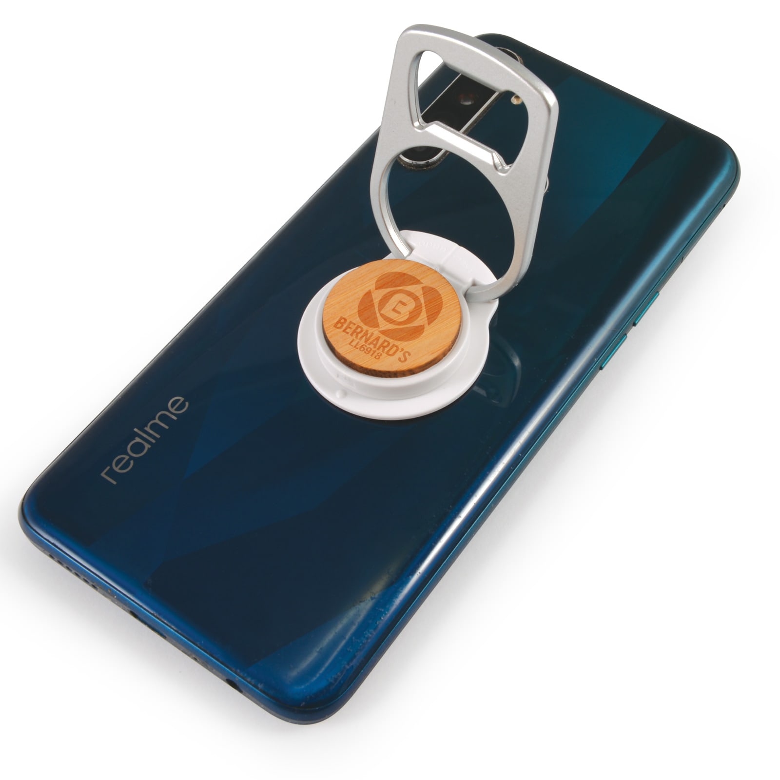 A drink bottle opener attached to a phone, featuring a silver opener and a circular wooden base on a dark blue phone.
