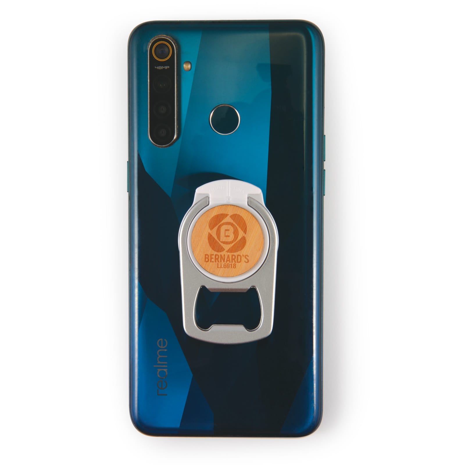 A drink bottle opener phone stand in silver and orange attached to a blue smartphone. The phone has a logo visible.