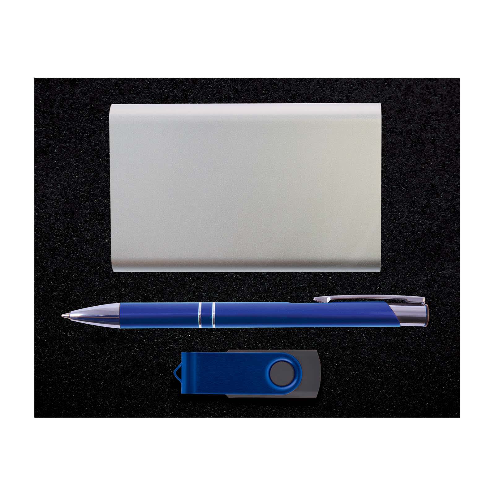 A silver card holder, a blue pen, and a blue USB flash drive arranged against a dark background.