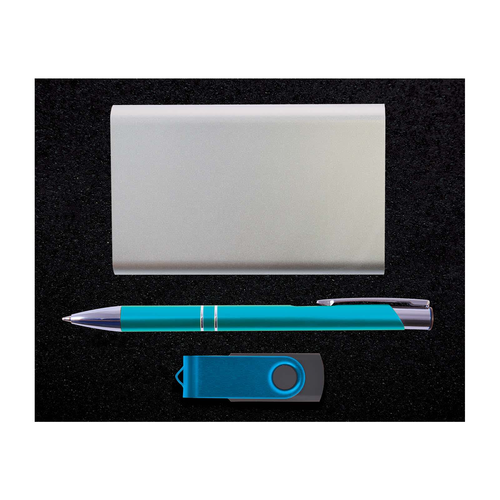 A teal pen, a silver cardholder, and a blue USB flash drive arranged on a black surface.
