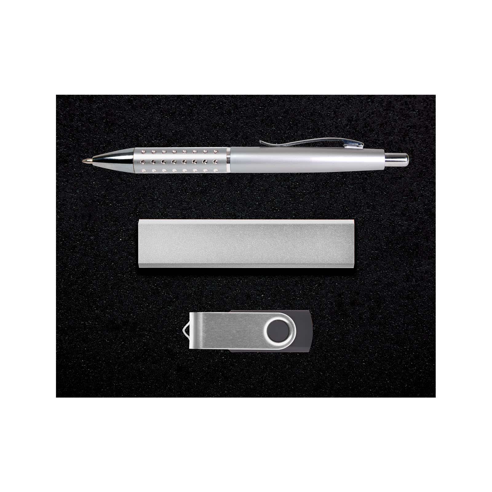 A silver pen, silver USB flash drive, and silver metal case arranged on a black background. The set features a logo.