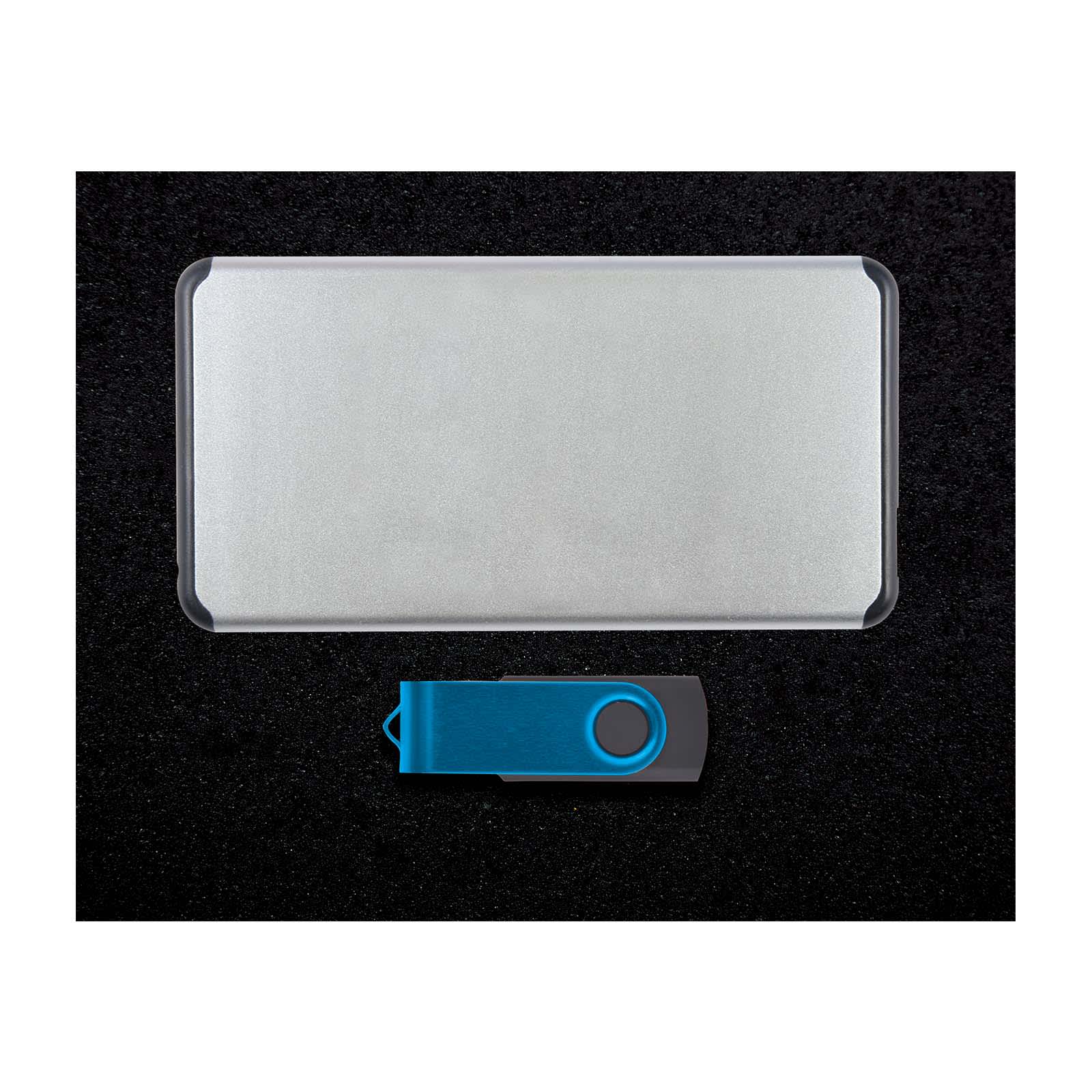 A silver power bank with a blue and black USB drive, presented on a black background.