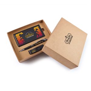 A cardboard gift set featuring a power bank, pen, and card holder in black and colorful accents. Includes branded packaging.