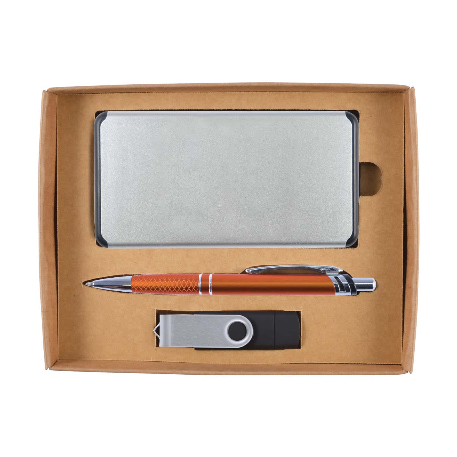 A cardboard gift set containing a power bank, a metallic pen, and a USB flash drive, all neatly arranged in a box.