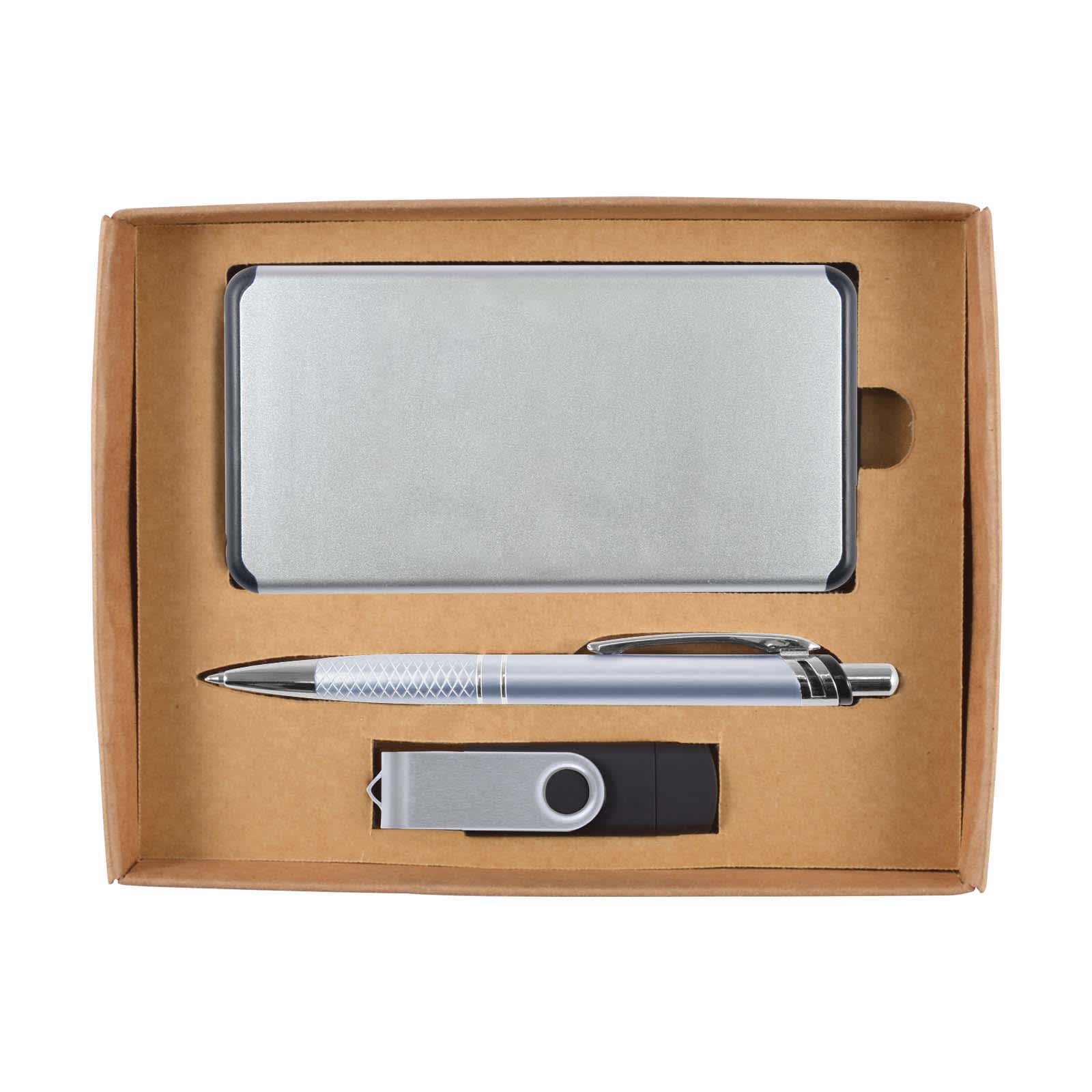 A cardboard gift set containing a silver power bank, a silver pen, and a silver and black USB drive.