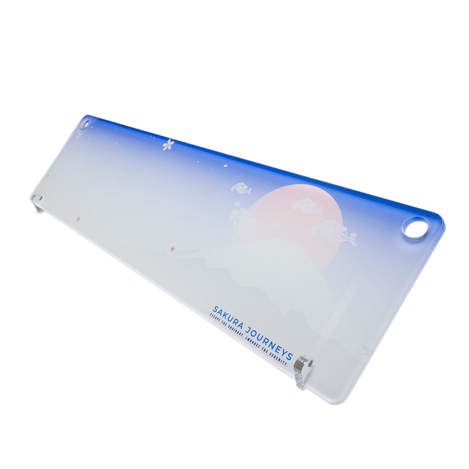 A desk mat featuring a soft, gradient design with a subtle illustration of the sky and celestial elements.