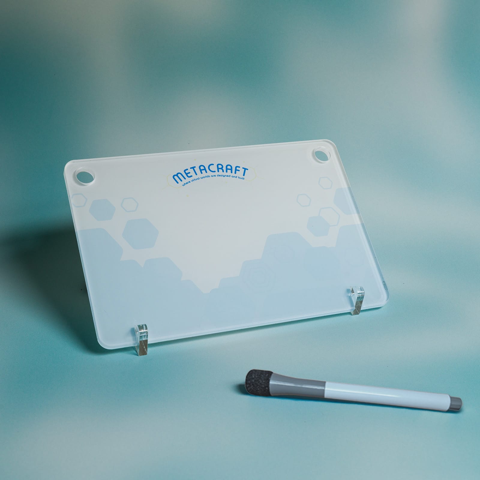 A transparent card with rounded corners and two holes at the top, designed for office use.