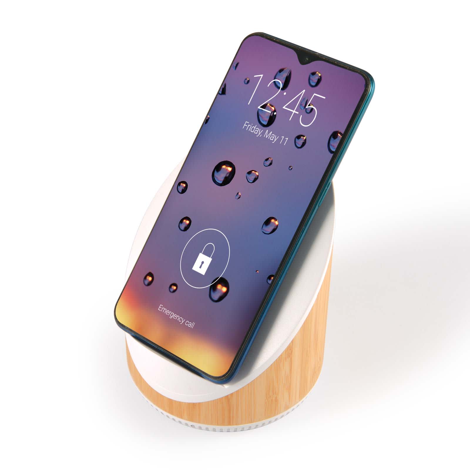 A wireless charger featuring a wooden base and a sleek phone resting on top, displaying a colorful, water droplet screen.
