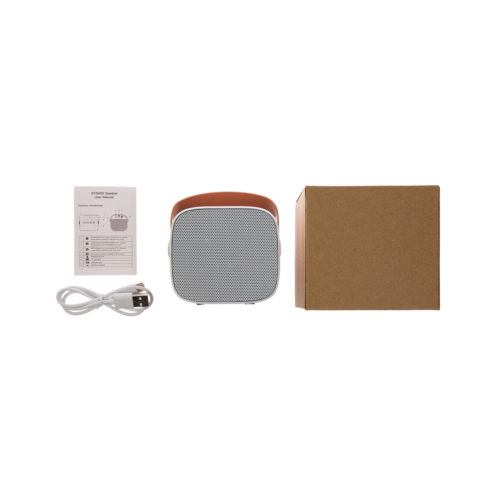 A mini speaker in gray and tan, accompanied by a charging cable, user manual, and a cardboard box.