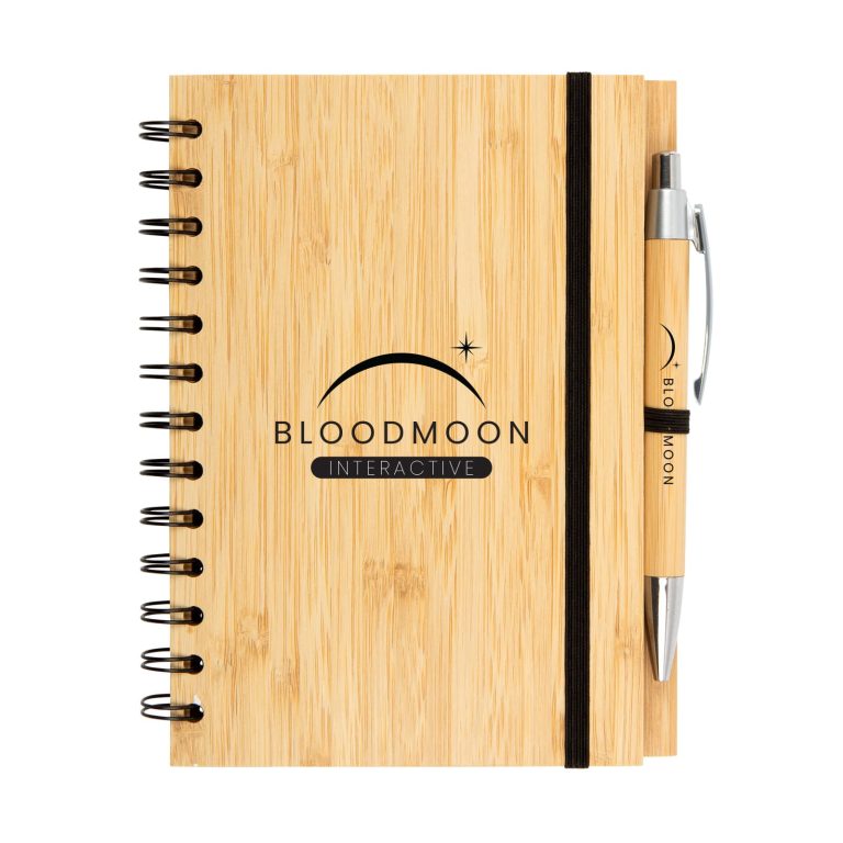 A bamboo notebook featuring a black spiral binding and an elastic band, accompanied by a matching pen.