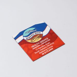 A square fridge magnet featuring a colourful design with a logo, predominantly in red, blue, and white.