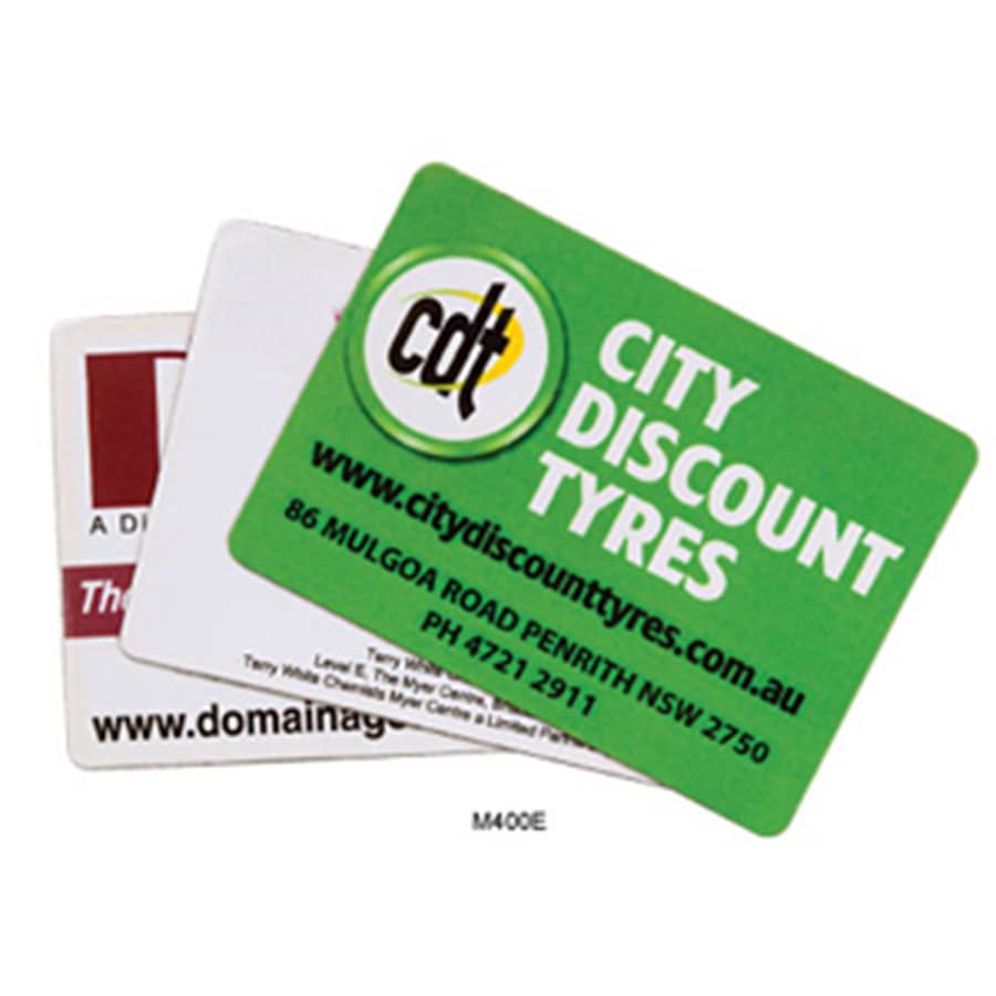 Three rounded corner fridge magnets in various colours, featuring different logos and designs, including one with a green background.