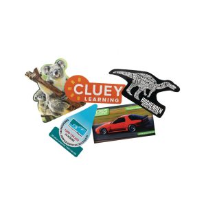 Custom magnets in various shapes and colours, featuring a koala, a car, a dinosaur, and a logo.