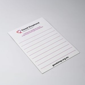 A white magnetic whiteboard featuring lined sections and a logo in the corner. It has a smooth, glossy finish.