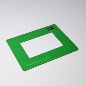 A green mouse mat featuring a central photo frame cut-out and a logo in one corner.