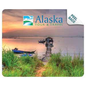 A mouse mat featuring a scenic image of a pier at sunset, with greenery and boats, showcasing blue and earthy tones.