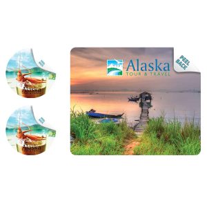 A mouse mat and two coasters featuring a scenic lakeside image in vibrant colours, with branding displayed.