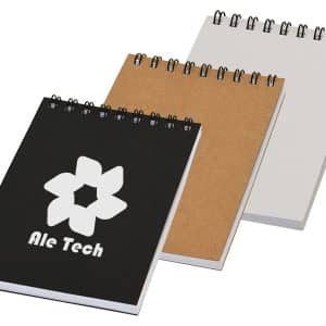 A pocket spiral notebook set featuring black, kraft, and white covers, with a logo on the black notebook.