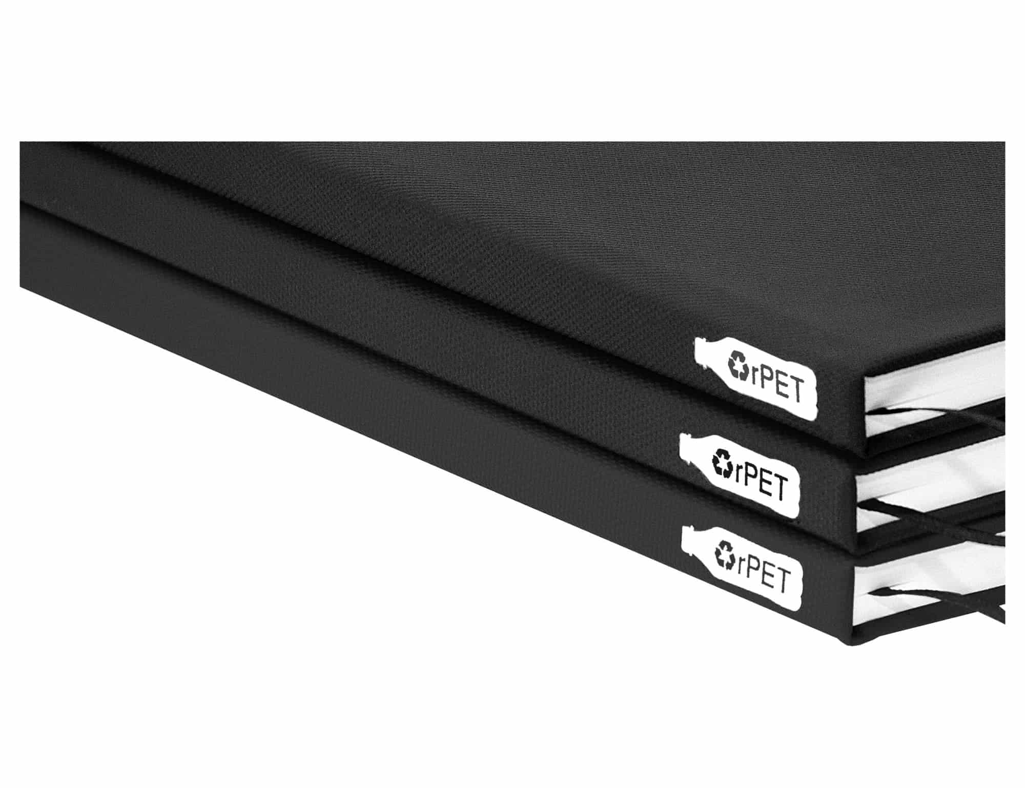 A black A5 notebook with a textured cover, featuring multiple sections and a logo.