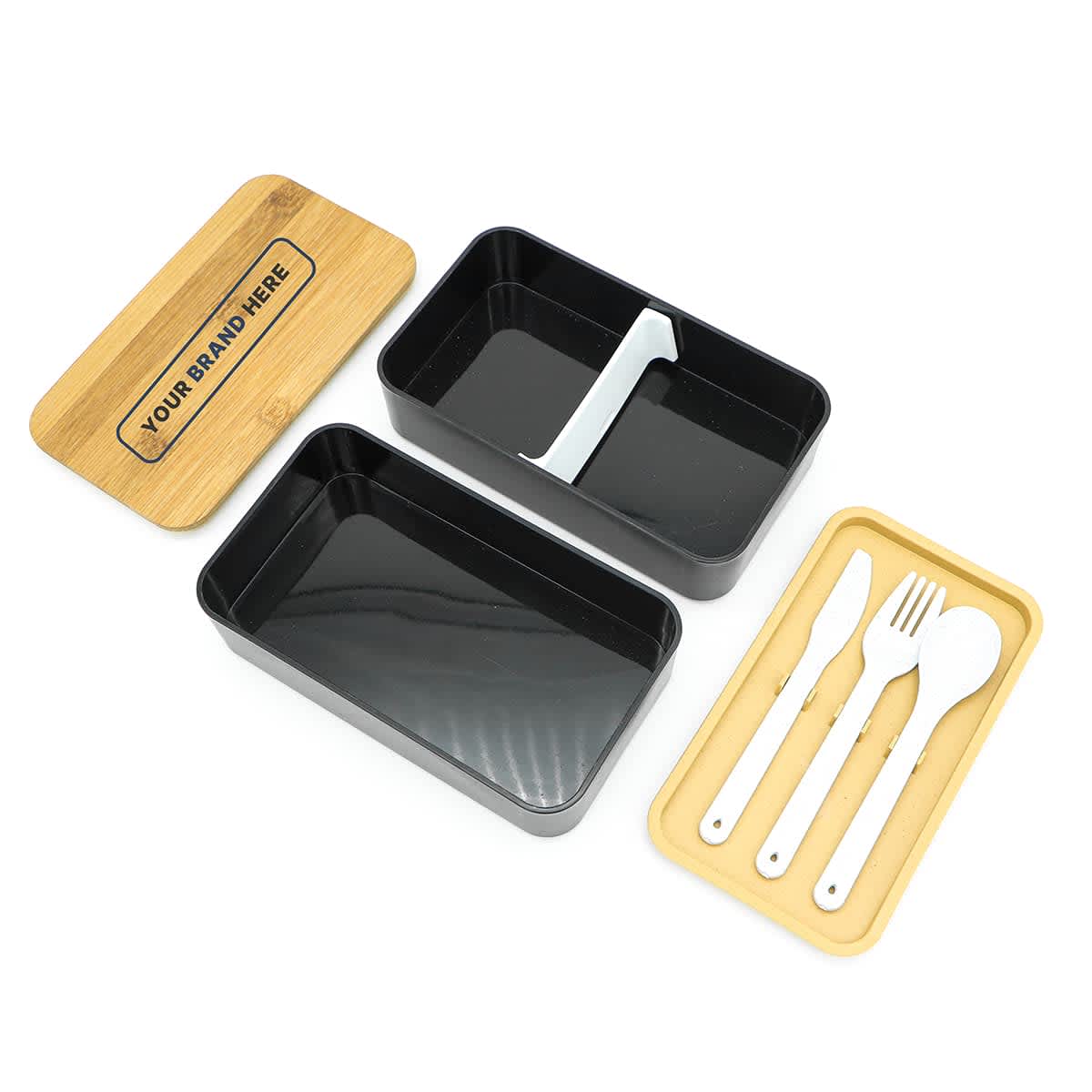 A two-layer lunch box with a bamboo lid, featuring a black inner compartment and a tray with cutlery.
