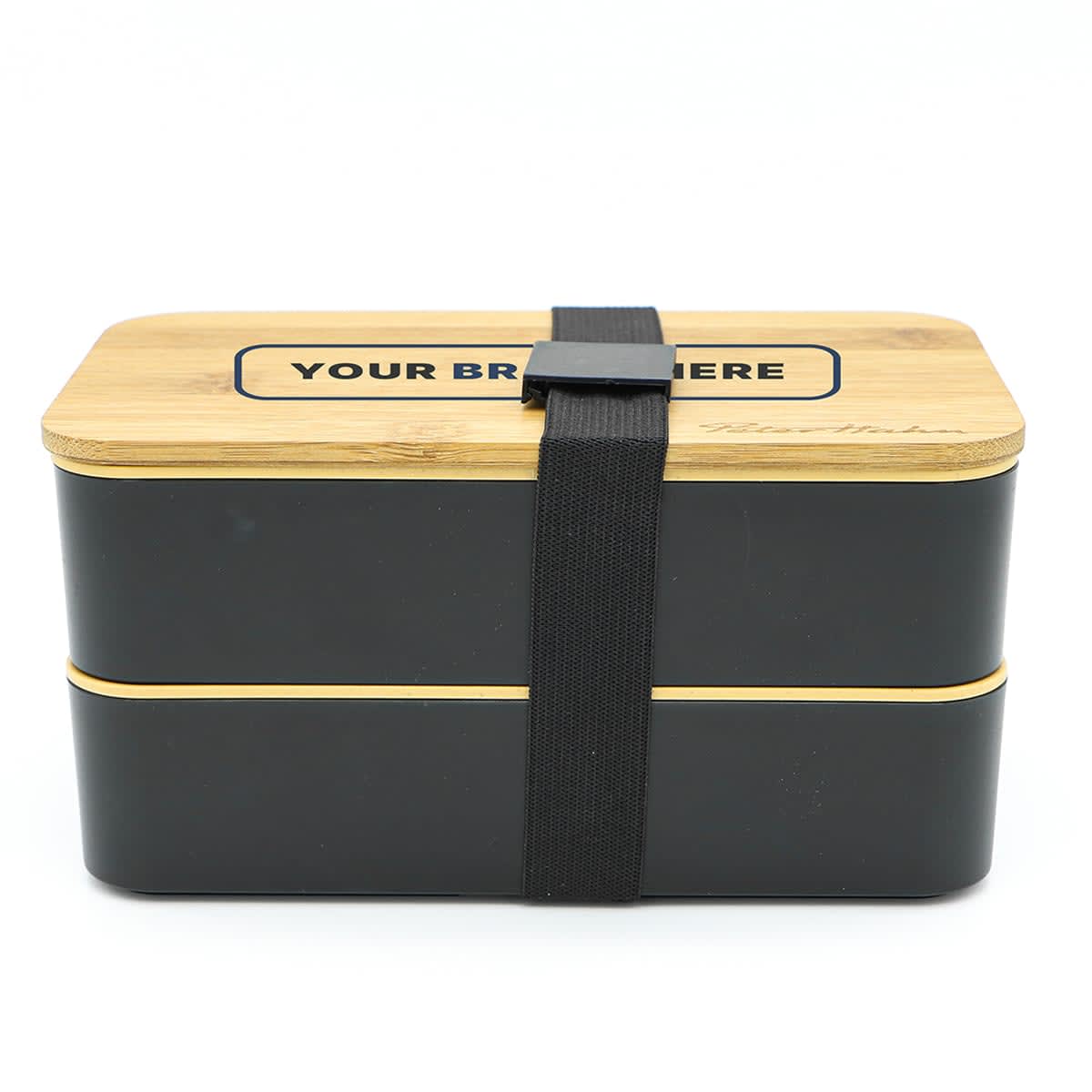 A two-layer lunch box with a dark exterior and a bamboo lid, secured with a black strap. Features a logo.