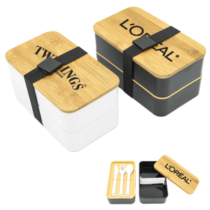 A two-layer lunch box set featuring a white and a black container with bamboo lids and a strap, includes utensils.